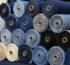 Different types of denim fabric swatches including selvedge stretch organic and heavyweight options for custom jeans and jackets manufacturing