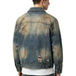 Acid wash men's denim jacket marbling effect distressed fabric and frayed edge macro close-up