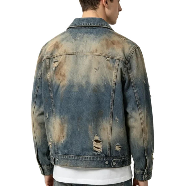 Acid wash men's denim jacket marbling effect distressed fabric and frayed edge macro close-up