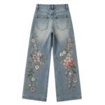 Women's embroidered bloom jeans artisan floral stitchwork on washed denim custom manufacturing