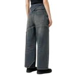 Fold-over waistband women's denim stitch detail fabric fold and layered construction macro close-up