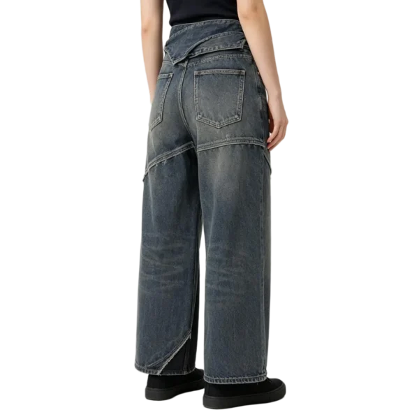 Fold-over waistband women's denim stitch detail fabric fold and layered construction macro close-up