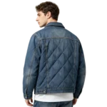 Quilted men's denim shacket diamond stitch pattern lightweight fabric and button macro close-up