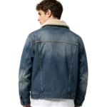 Sherpa lined men's denim jacket fleece lining texture outer denim fabric and seam macro close-up