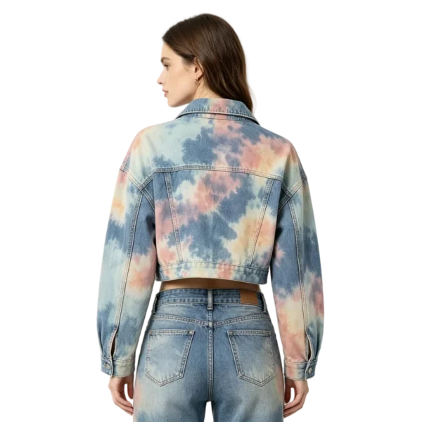 Tie-dye cropped women's denim jacket color blend effect washed fabric and dye pattern macro close-up